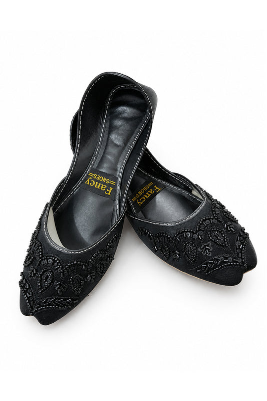 A pair of black pointed-toe flats with floral lace embroidery and beadwork, displayed on a clean white background. The brand name 'Fancy Shoes' is visible on the inner sole of the shoes.