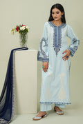 Woman wearing a light blue embroidered kurta with a matching dupatta, standing next to a white pedestal with flowers.